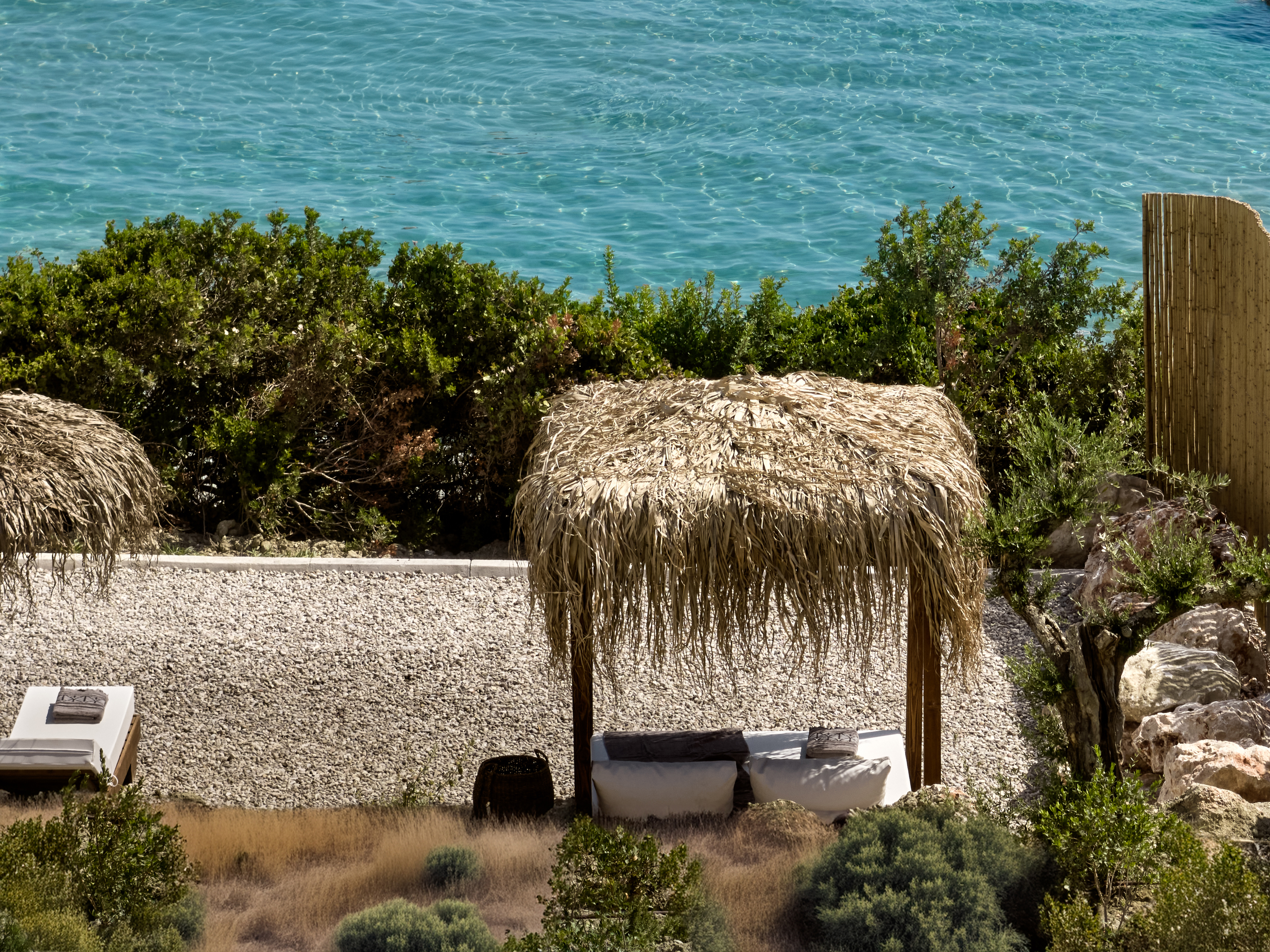 The shared - beach sunbathing area is located in front of Esthesis Villas