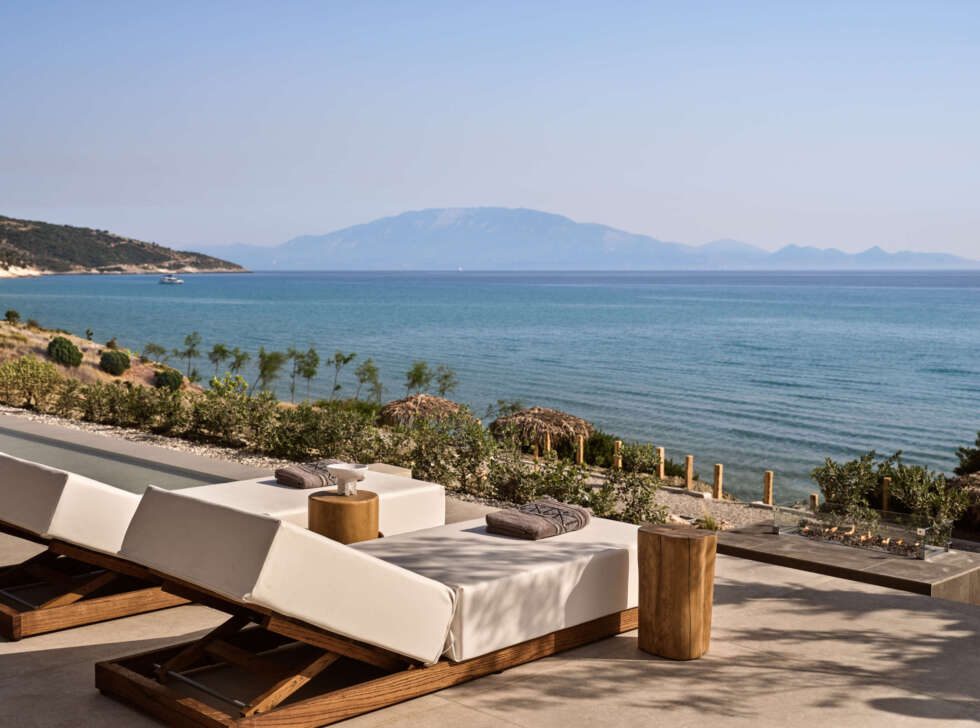 Premium sun-beds are featured and a fire pit.